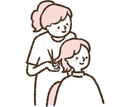 美容院で髪を切る女性
